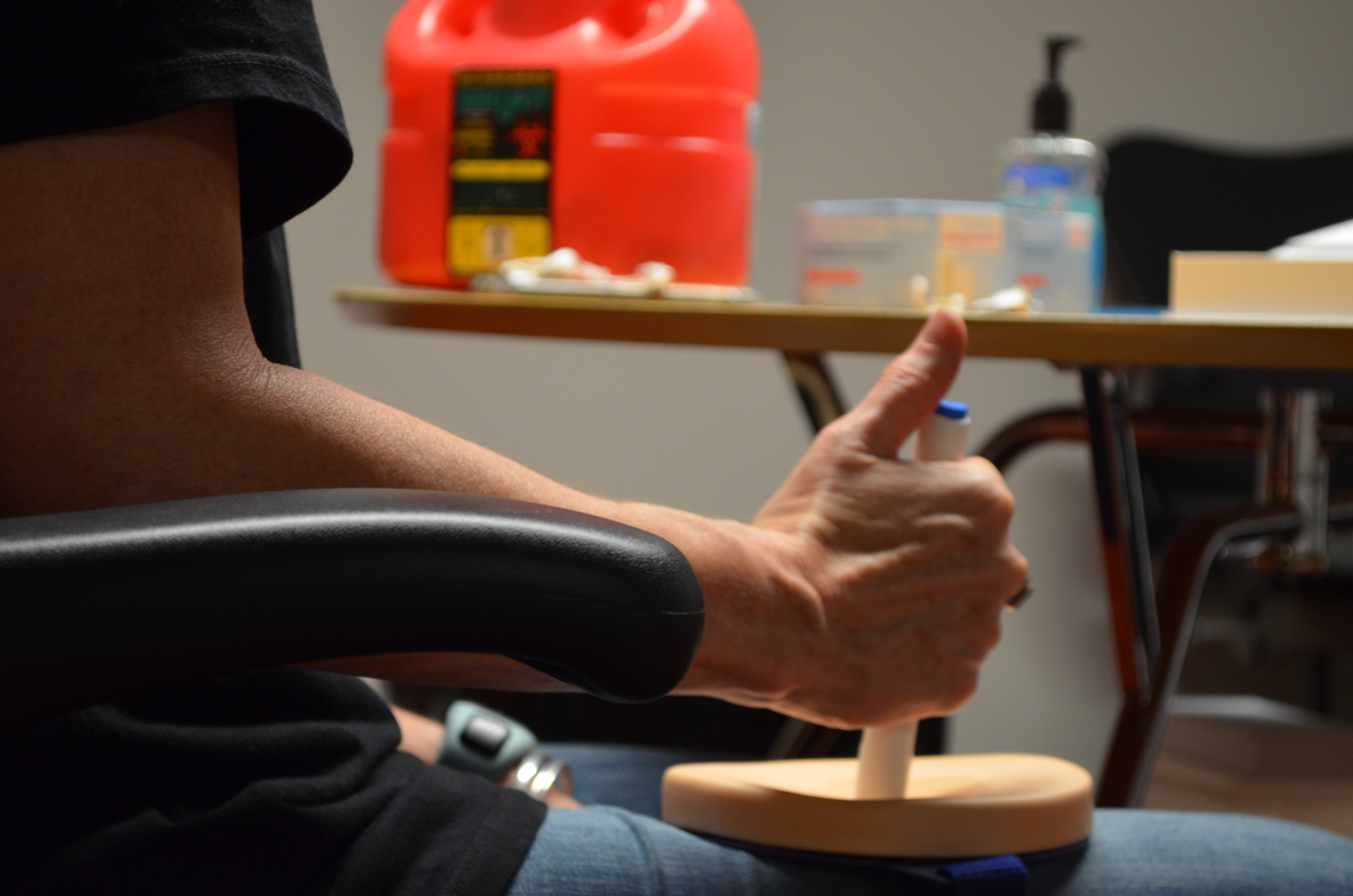 Figure 2: A participant injects with a training device on an injection pad.